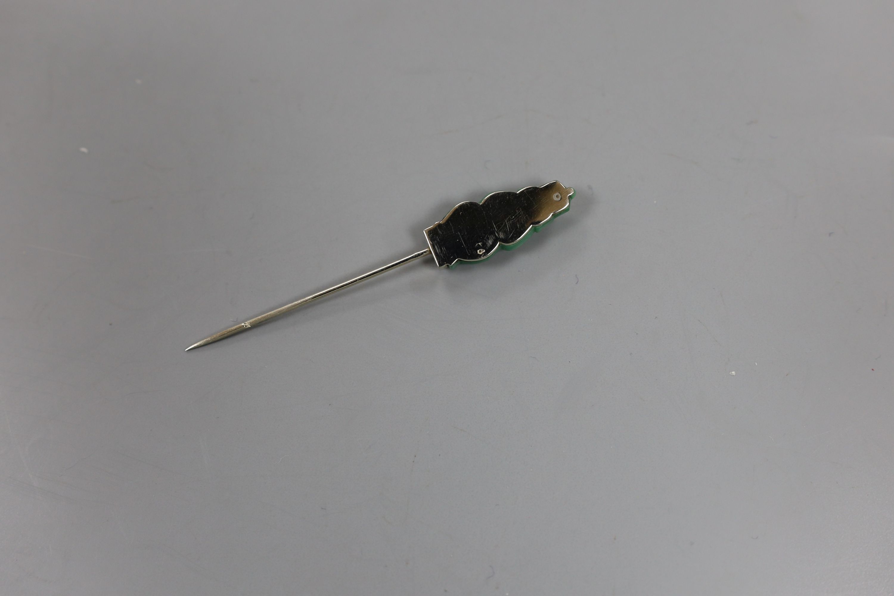 An early 20th century French white metal (18ct poincon mark), simulated jade and diamond chip set stick pin (ex jabot pin)